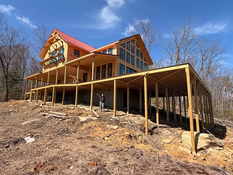 Timber framing for Red River Château's large covered deck during construction